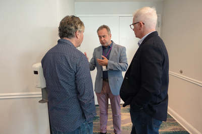 Three attendees talking